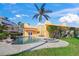 Inviting pool and spa area with lush landscaping at 929 Casey Cove Dr, Nokomis, FL 34275