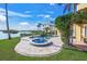 Inviting pool and spa area with waterfront views at 929 Casey Cove Dr, Nokomis, FL 34275