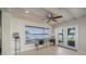 Relaxing sunroom with water views and French doors at 929 Casey Cove Dr, Nokomis, FL 34275