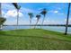 Scenic waterfront property with palm trees at 929 Casey Cove Dr, Nokomis, FL 34275