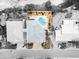 Bird's eye view of a house with a pool and yard at 107 75Th St, Holmes Beach, FL 34217