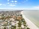 Aerial view of beachfront homes and the coastline at 107 75Th St, Holmes Beach, FL 34217