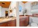 Small bathroom with granite vanity and toilet at 107 75Th St, Holmes Beach, FL 34217