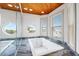 Bathroom with large soaking tub and window at 107 75Th St, Holmes Beach, FL 34217