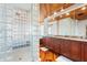 Large bathroom with walk-in shower and double vanity at 107 75Th St, Holmes Beach, FL 34217