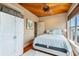 Bedroom with queen-size bed and wood floors at 107 75Th St, Holmes Beach, FL 34217