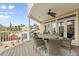 Deck with outdoor dining set and scenic neighborhood views at 107 75Th St, Holmes Beach, FL 34217