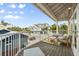 Relaxing outdoor deck with seating area, offering scenic neighborhood views at 107 75Th St, Holmes Beach, FL 34217