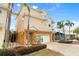 Two-story house with a two-car garage and landscaping at 107 75Th St, Holmes Beach, FL 34217