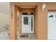 Front entrance with white door and glass panels at 107 75Th St, Holmes Beach, FL 34217