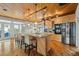 Island kitchen features granite countertops, stainless steel appliances, and wood flooring at 107 75Th St, Holmes Beach, FL 34217