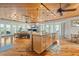 Open concept kitchen with island and hardwood floors at 107 75Th St, Holmes Beach, FL 34217