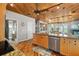 Open kitchen with island, hardwood floors and stainless steel appliances at 107 75Th St, Holmes Beach, FL 34217