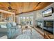 Bright living room with hardwood floors and fireplace at 107 75Th St, Holmes Beach, FL 34217