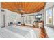 Bright main bedroom with sitting area, bay window, and wood floors at 107 75Th St, Holmes Beach, FL 34217