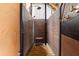 Outdoor shower with wood-paneled walls and bench at 107 75Th St, Holmes Beach, FL 34217