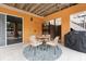 Outdoor patio with seating and grill at 107 75Th St, Holmes Beach, FL 34217