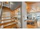 Wooden staircase leading to upper level with built-in shelving at 107 75Th St, Holmes Beach, FL 34217