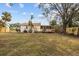 House backyard view with deck and large yard at 1206 30Th W St, Bradenton, FL 34205