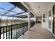 Long balcony with pool and landscape views, offering an outdoor retreat at 1450 Bern Creek Loop, Sarasota, FL 34240