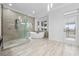 Spa-like bathroom with soaking tub and walk-in shower at 1450 Bern Creek Loop, Sarasota, FL 34240