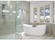 Bathroom boasts a soaking tub and a walk-in shower at 1450 Bern Creek Loop, Sarasota, FL 34240