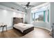 Bedroom with wood floors and large window at 1450 Bern Creek Loop, Sarasota, FL 34240