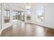 Bright dining room with hardwood floors and access to a screened patio at 1450 Bern Creek Loop, Sarasota, FL 34240