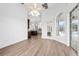 Bright dining room with hardwood floors and views of the kitchen at 1450 Bern Creek Loop, Sarasota, FL 34240