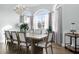 Elegant dining room featuring a large wooden table and chandelier at 1450 Bern Creek Loop, Sarasota, FL 34240