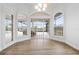 Bright dining room with hardwood floors and access to a screened patio at 1450 Bern Creek Loop, Sarasota, FL 34240