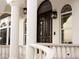 Elegant double front doors with sidelights and lanterns at 1450 Bern Creek Loop, Sarasota, FL 34240