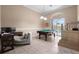 Game room with pool table and adjacent workspace at 1450 Bern Creek Loop, Sarasota, FL 34240