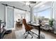 Spacious home office with a view and a stylish barn door at 1450 Bern Creek Loop, Sarasota, FL 34240