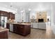 Open concept kitchen and living area with hardwood floors at 1450 Bern Creek Loop, Sarasota, FL 34240