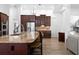 Island kitchen with granite countertops and stainless steel appliances at 1450 Bern Creek Loop, Sarasota, FL 34240