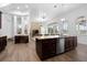 Open kitchen with large island and stainless steel appliances at 1450 Bern Creek Loop, Sarasota, FL 34240