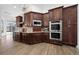 Modern kitchen with double ovens and granite countertops at 1450 Bern Creek Loop, Sarasota, FL 34240