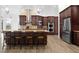 Gourmet kitchen with dark wood cabinets, granite counters and stainless steel appliances at 1450 Bern Creek Loop, Sarasota, FL 34240