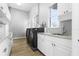 Laundry room with washer, dryer, and ample counter space at 1450 Bern Creek Loop, Sarasota, FL 34240