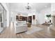 Open concept living room with kitchen views and a large sectional sofa at 1450 Bern Creek Loop, Sarasota, FL 34240