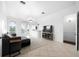 Bright living room featuring a comfortable couch and access to a balcony at 1450 Bern Creek Loop, Sarasota, FL 34240