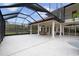 Expansive covered patio with pool and spa, offering ample space for relaxation at 1450 Bern Creek Loop, Sarasota, FL 34240
