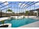 Inviting screened pool and spa with lush landscaping at 1450 Bern Creek Loop, Sarasota, FL 34240