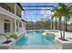 Inviting screened pool and spa with lush landscaping at 1450 Bern Creek Loop, Sarasota, FL 34240
