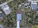 House and lot, aerial view showing surrounding houses and trees at 1463 Jinright Rd, North Port, FL 34288