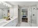 Elegant bathroom features double vanity, walk-in shower, and marble tile at 1463 Jinright Rd, North Port, FL 34288