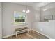 Bright and airy entryway with a bench and natural light at 1463 Jinright Rd, North Port, FL 34288