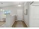 Light and airy entryway with wood floors and a view to the kitchen at 1463 Jinright Rd, North Port, FL 34288