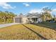 Single story house with a large front yard at 1463 Jinright Rd, North Port, FL 34288